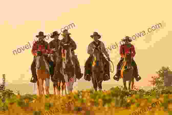 A Group Of Cowboys On Horseback Riding Through A Vast And Rugged Landscape, With A Sunset In The Background Knights Of The Range: A Western Story