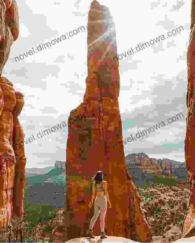 A Hiker Stands In Awe Of The Towering Red Rock Vortex In Sedona Arizona S Scenic Roads And Hikes: Unforgettable Journeys In The Grand Canyon State