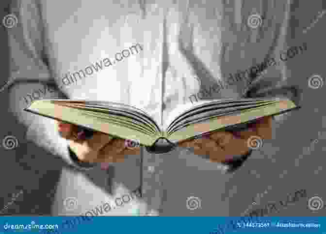 A Person Holding A Book In Their Hands Between The Water And The Woods